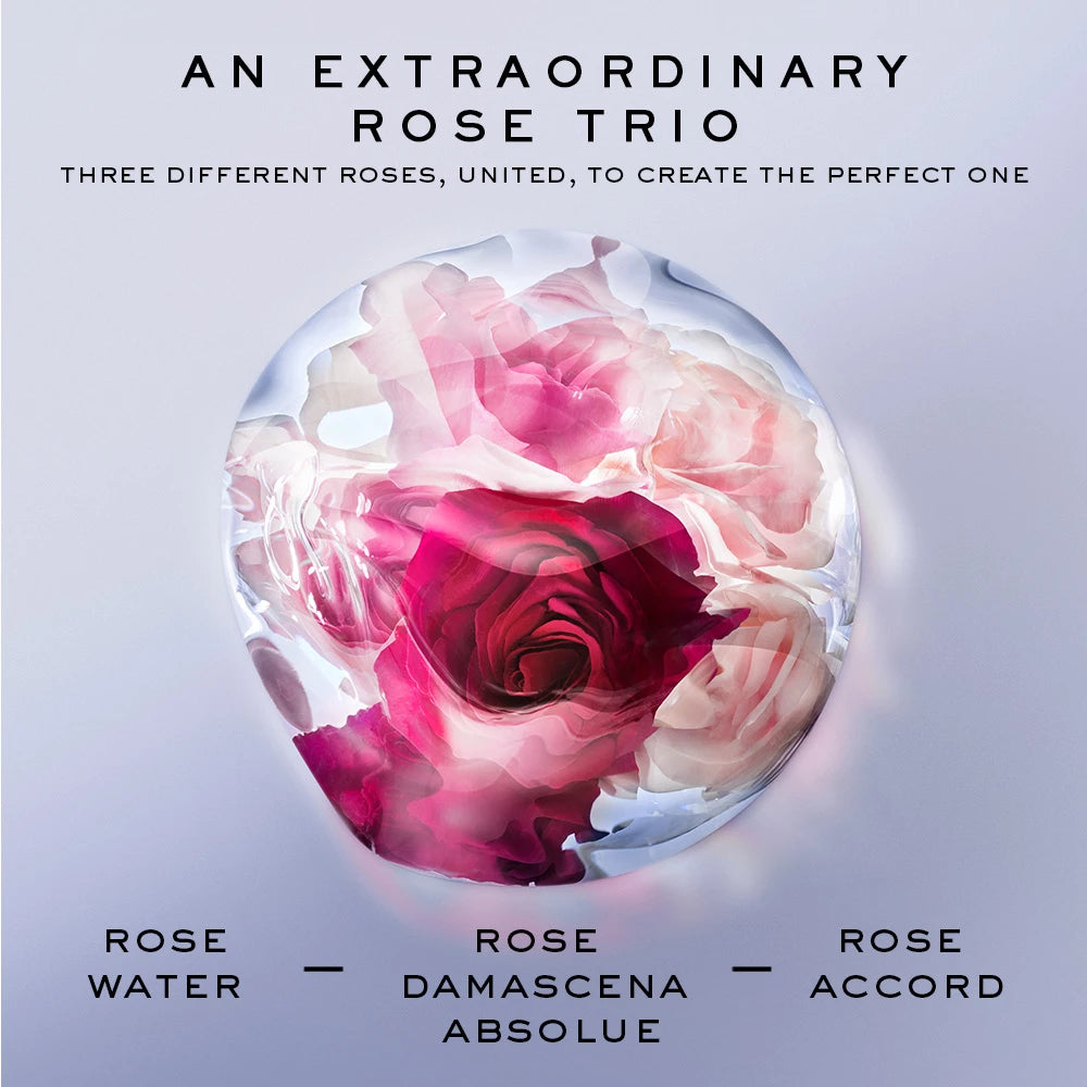 Three rose extracts used in La Vie Est Belle Rose Extraordinaire - fresh rose water, rose damascena absolue, and rose accord - displayed with fresh rose petals.