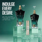 A perfume bottle displayed on a clear acrylic pedestal against a teal gradient background. The bottle has a sculpted hourglass shape with a dark black upper section, a deep green-to-teal gradient lower section, and a gold cap.