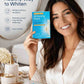 Woman holding Lumineux Whitening Strips packaging in a bathroom setting