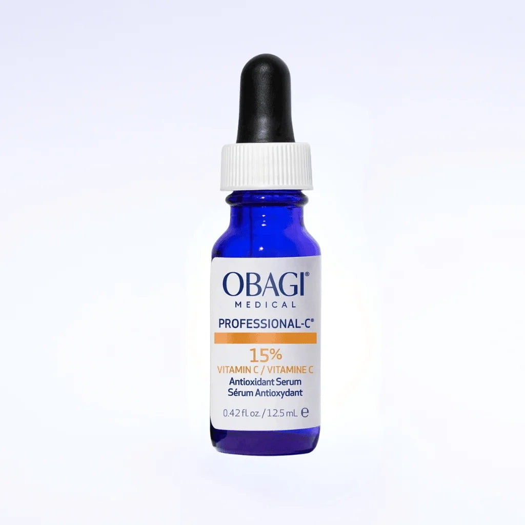 A bottle of Obagi Medical Professional C+ 15% Vitamin C Antioxidant Serum in a cobalt blue glass dropper bottle with a white cap and black rubber bulb, set against a clean white background.