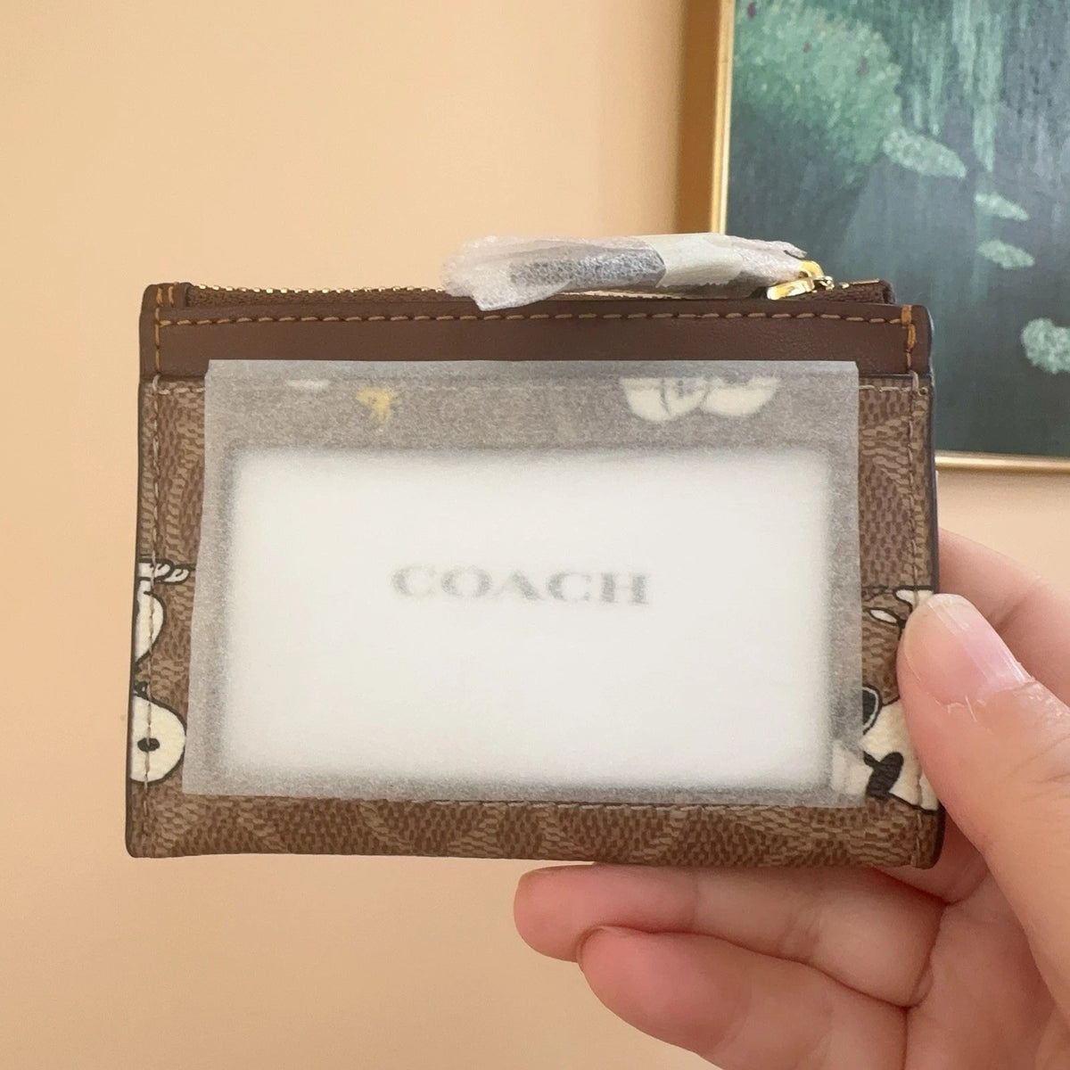 Coach x Peanuts Mini Skinny ID Case, Snoopy Print Signature Canvas, Tan
